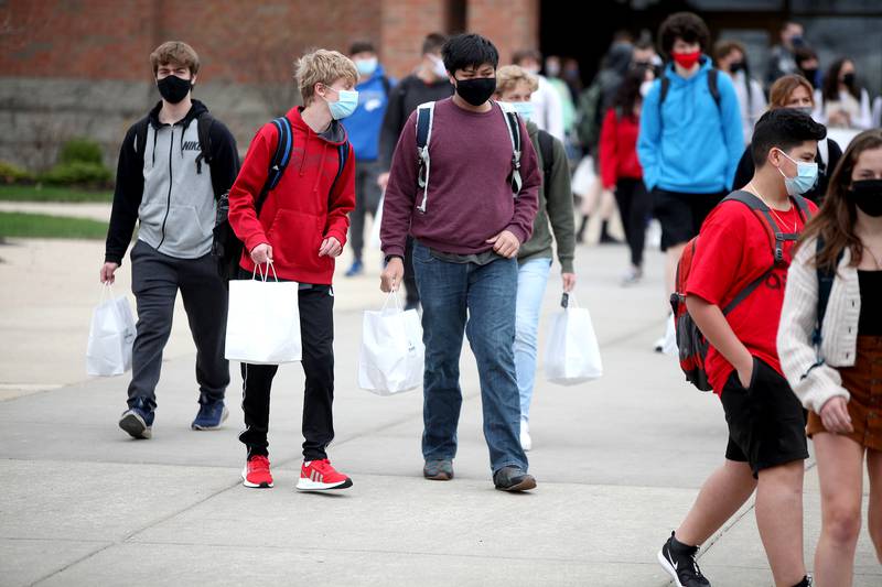 St. Charles North High School students leave for the day on Friday, April 9, 2021. High school students in St. Charles School District 303 began in-person learning five days a week on April 5.