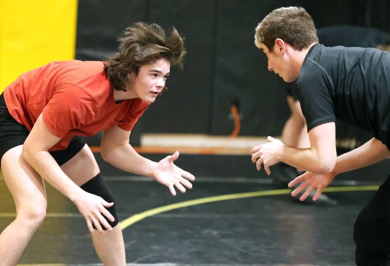Sycamore wrestler Gabriel Crome (left) works with teammate Jaden Cochran Tuesday, Jan. 31, 2023, during practice at Sycamore High School.