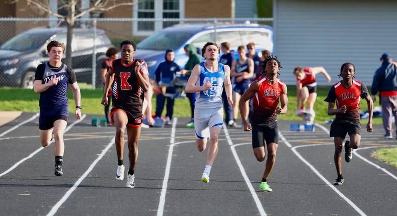 Princeton's Gavin Lanham (center) and Hall's  Jeremy Smith and Bryan Smith race in the 100 meters in Tuesday's Howard-Monier Invite.