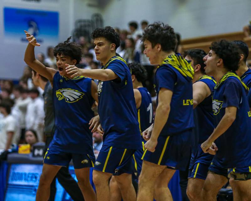 The Leyden bench greets the starters during a timeout in their basketball game at Downers Grove South. Feb 9, 2024.