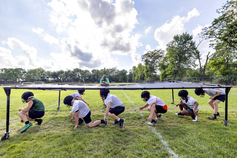 Rock Falls players run through drills Tuesday, August 12, 2025. The team hit the gridiron for day two of practices ahead of the 2025 season.