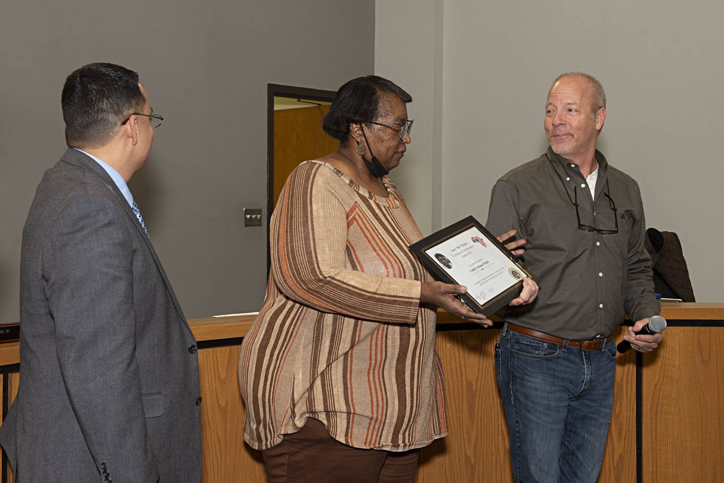 Linda LeBlanc-Parks accepts the Ike Mercer certificate of achievement from Dixon City Councilman Mike Venier on Tuesday.