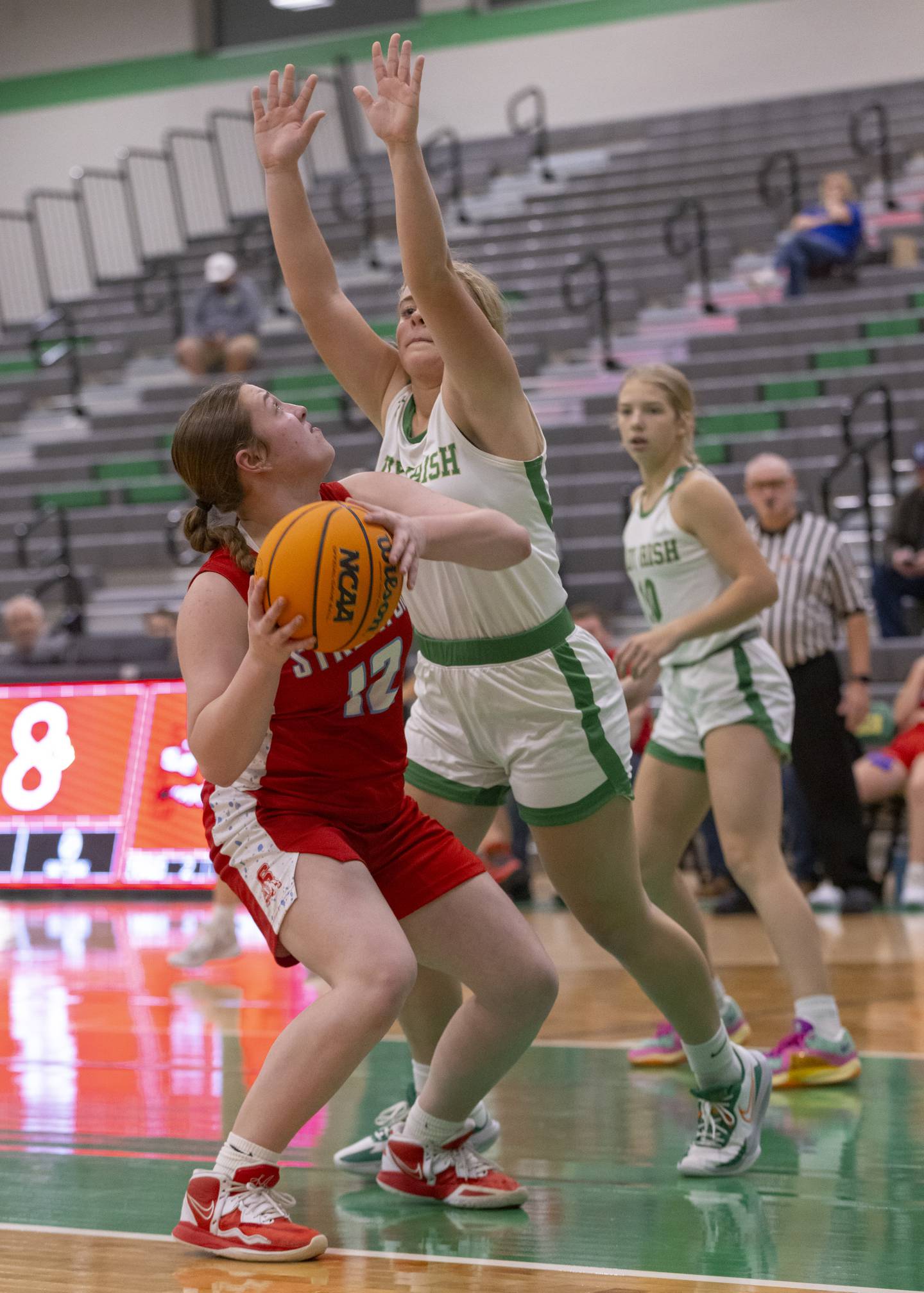 Streator's Leah Krohe looks for a shot over the Seneca High School defense during the Falcon-Irish Girls Basketball Tournament earlier this season at Seneca High School.