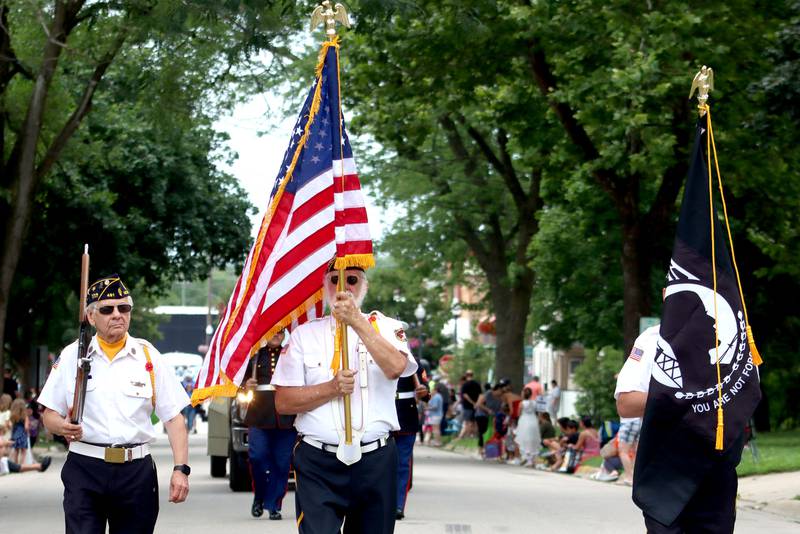 Veterans march to begin the Fiesta Days Parade on Main Street in McHenry on Sunday, July 20, 2025.
