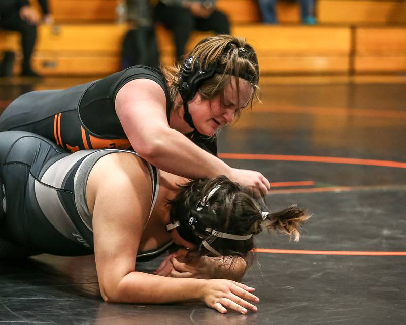 Minooka's Peyton Kueltzo goes against Joliet's Natall Quiroz i in their 235 class match during the Joliet Township at Minooka Girls Wrestling tournament.  Dec. 13, 2023.