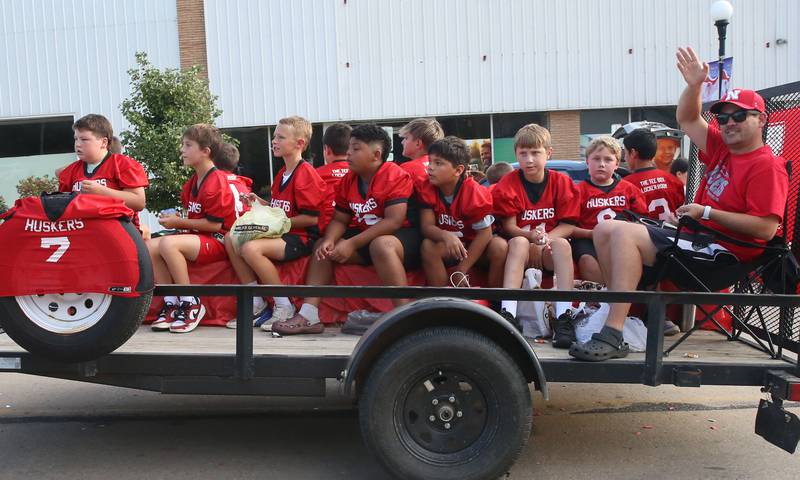 The Huskers flag football team rides during the Homecoming parade on Thursday, Sept. 18, 2025 downtown Spring Valley.