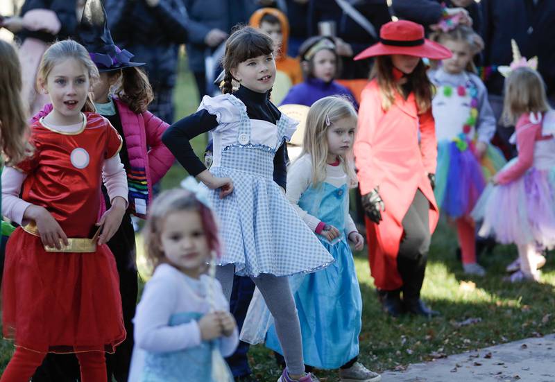 Kids dance during the Monster Mash Dance Party at Fishel Park in Downers Grove, Ill. on Saturday, October 29, 2022.