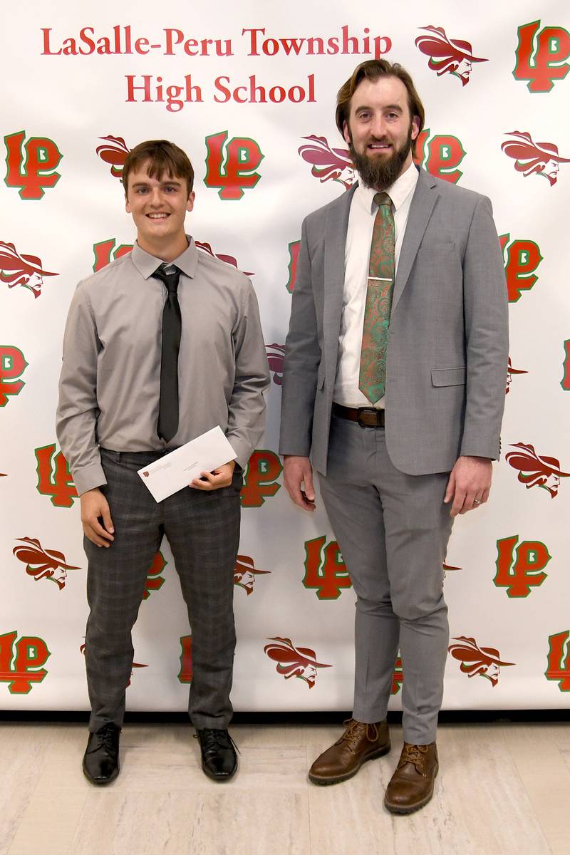 Alex Anderson (left) received the Tirza B. Ennor Mathematics Scholarship. This scholarship in honor of Tirza B. Ennor, a former L-P math teacher, is awarded to a graduating senior of L-P High School who has attended L-P for at least three years. The student must have completed four years of college preparatory math, plans to enroll in college upon graduation from high school and have demonstrated good character throughout their high school career. The scholarship was presented by math teacher Matt Makeever.