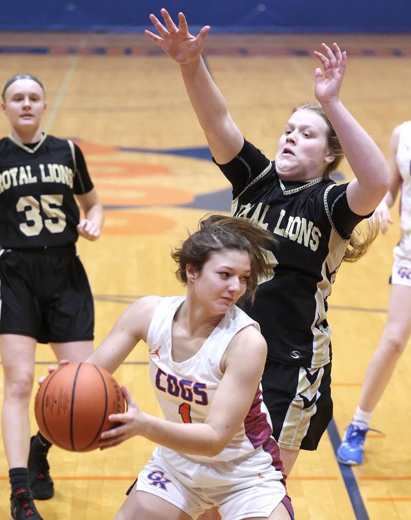 Genoa-Kingston's Taylor Rhoads pulls down a rebound in front of Rockford Christian's Courtney Park defenders during their game Friday, Jan. 13, 2023, at Genoa-Kingston High School.