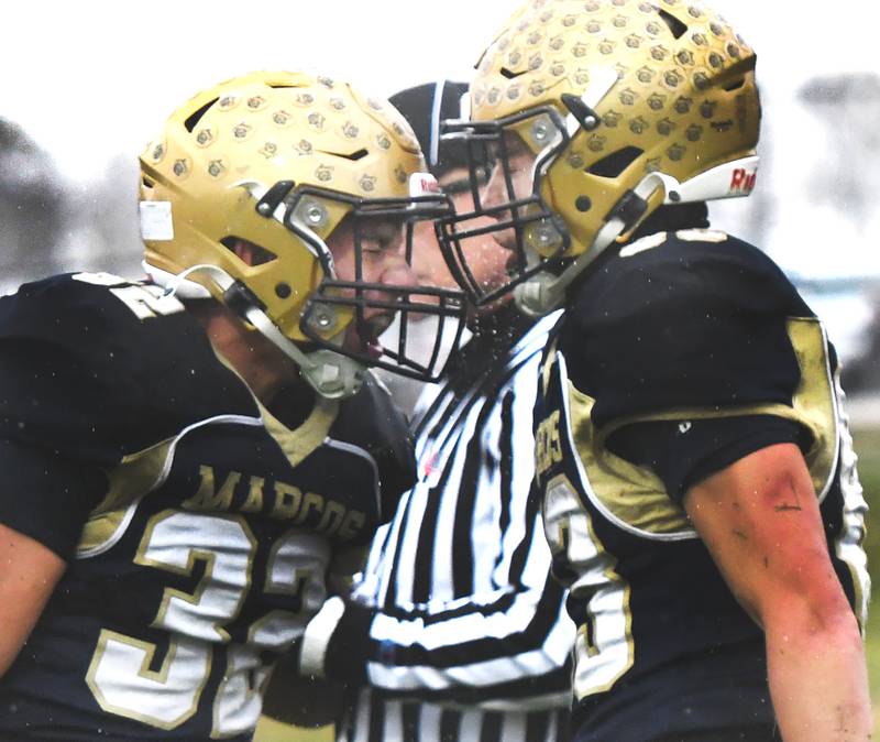 Polo's Eli Perez (left) and Mercer Mumford celebrate a score against St. Anne on Saturday, Nov. 8, 2025 during I8FA playoff action at Polo High School. The Marcos won the game 46-14 to advance to the next round.