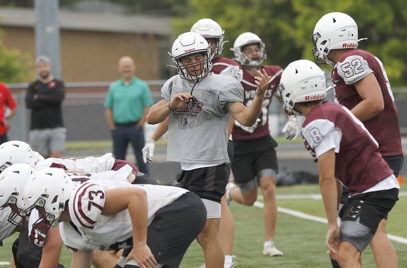 Prairie Ridge quarterback Luke Vanderwiel directs his team during football practice against Grant on Thursday, July 17, 2025, at Grant High School in Fox Lake.