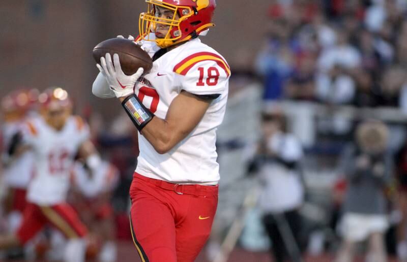 Batavia’s C.J. Valente catches a pass for a touchdown during a game at St. Charles North on Friday, Sept. 15, 2023.