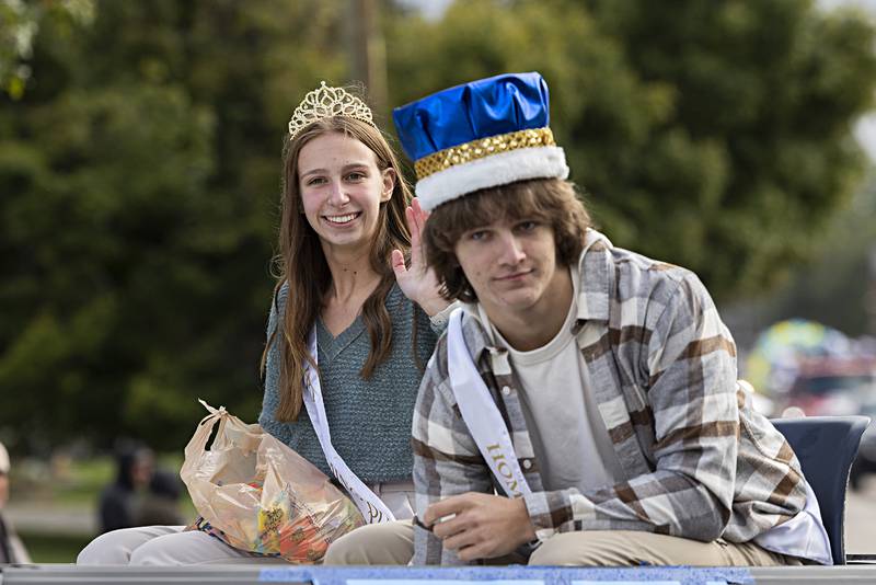 Sterling homecoming Queen Emily Lofgren and King Garrett Polson ride through the homecoming parade Friday, Oct.6, 2023.