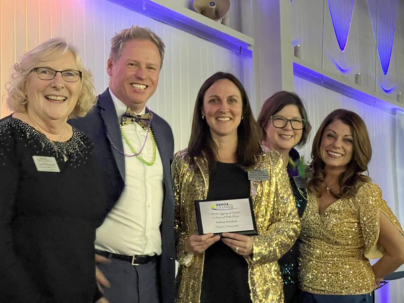 Carol Romano, Mark Carlson, Melissa Davidson, Krissy Johnson, and Cortney Strohacker stand together after Davidson was given the first-ever Legacy of Service award on Feb. 11, 2026, at the 60th annual Genoa Area Chamber of Commerce meeting and award dinner.