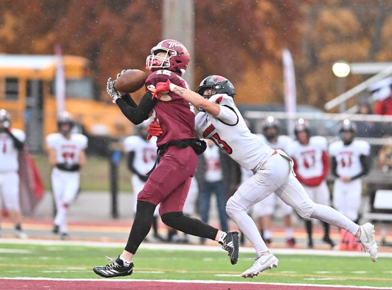 Morris Rj Kennedy (12) catches a deep pass during the class 4A second round playoff game against Metamora on Saturday, NOV. 08, 2025, at Morris.