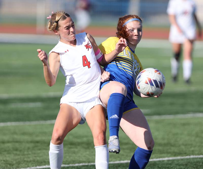 Lyons Township's Izzi Wirtz (12) and Hinsdale Central's Carter Knotts (4) fight for the ball during the IHSA Class 3A girls soccer sectional final match between Lyons Township and Hinsdale Central at Reavis High School in Bubank on Friday, May 26, 2023.