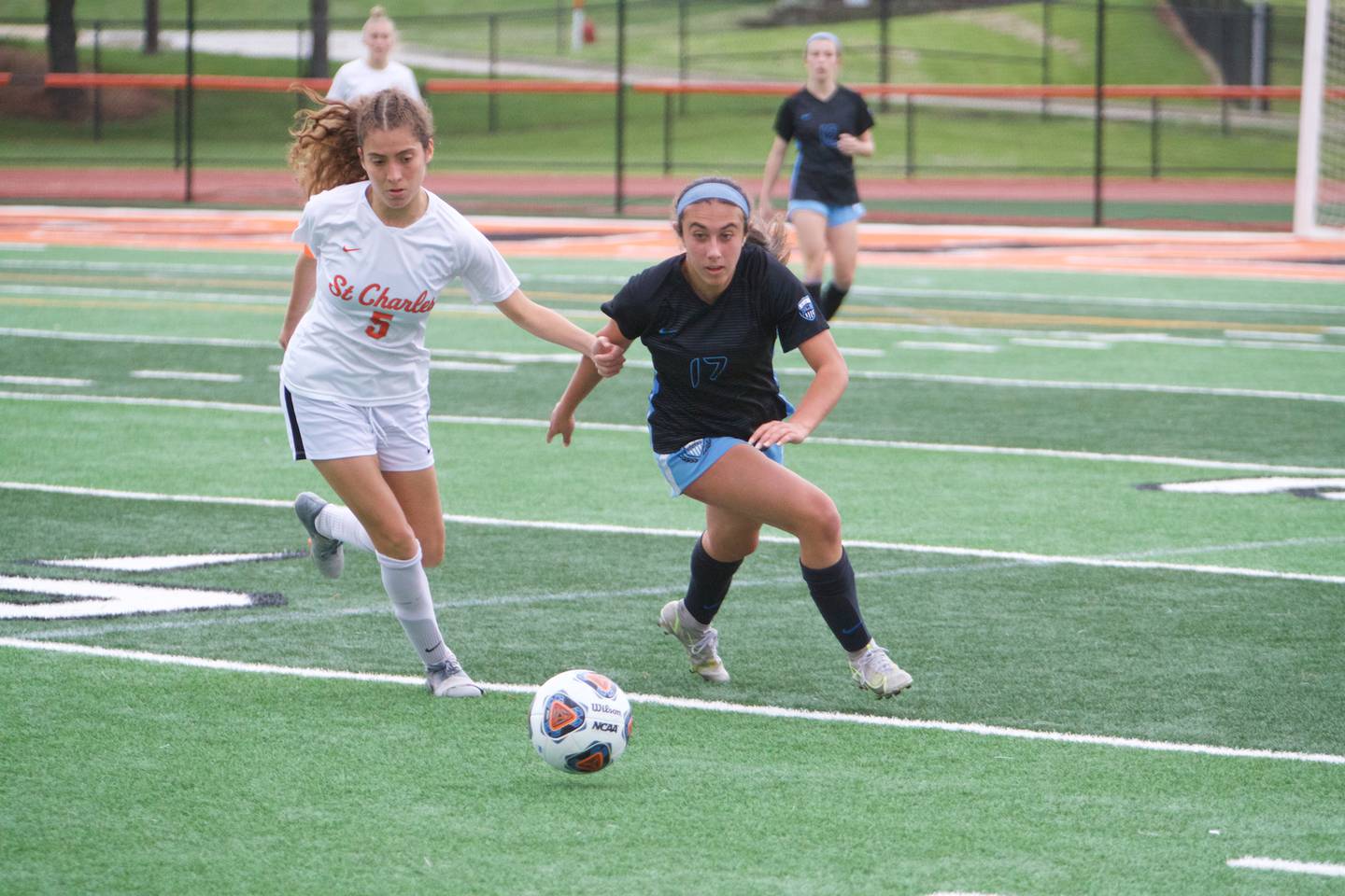 St. Charles North's Bella Najera looks to keep control of the ball from St. Charles East's Yazmin Martinez at the Class 3A Sectional Final on May 27, 2022 in St. Charles.