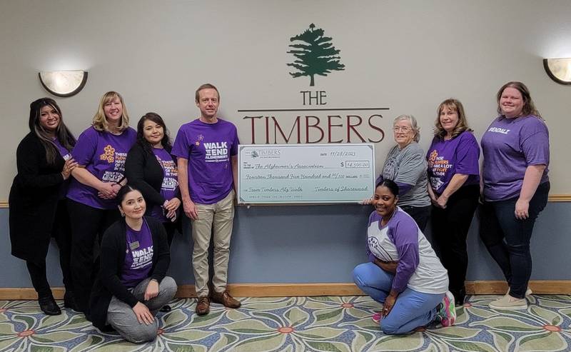 Pictured (Back row L to R): Sheila Albor, director of marketing; Amy Odell, activities director; Toya Dorado, housekeeping manager; Kevin Young, executive director; Diane Pfoser, activities dept; Lisa Molenda, business office manager; and Kayli Rizzo, senior manager, Walk to End Alzheimer’s, Illinois Chapter of the Alzheimer's Association. (Front Row): Stacy Ascencio, leasing coordinator; Ebonii Roland, director of homecare