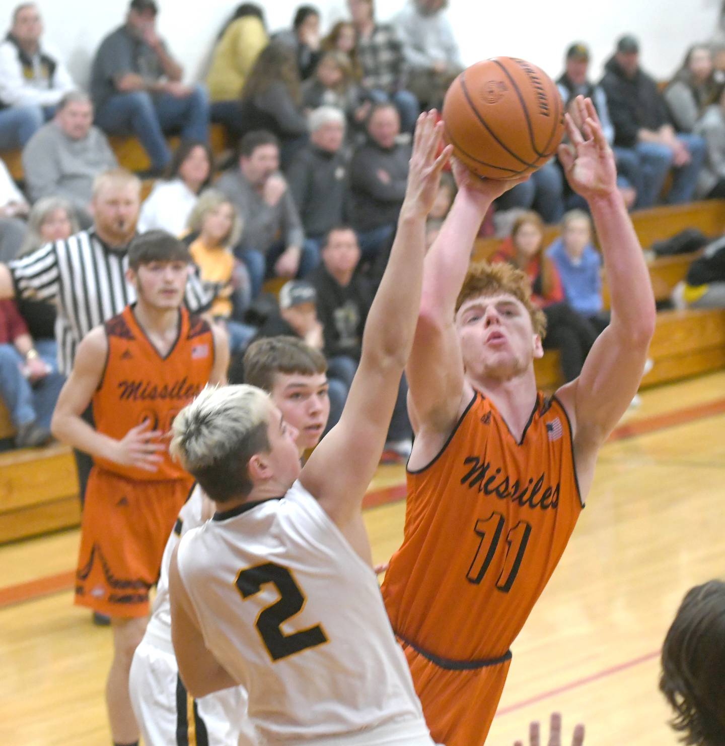 Milledgeville's Connor Nye drives the lane and puts up a shot during Saturday action against Lena-Winslow at the 61st Forreston Holiday Tournament.