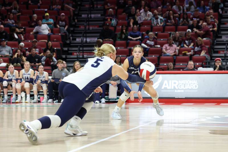 Cissna Park's Mady Marcott executes a dig as Kendyl Neukomm looks on during the Timberwolves' victory in two sets, 25-11, 25-14, over Stockton in the IHSA Class 1A State championship on Saturday, Nov. 15, 2025.