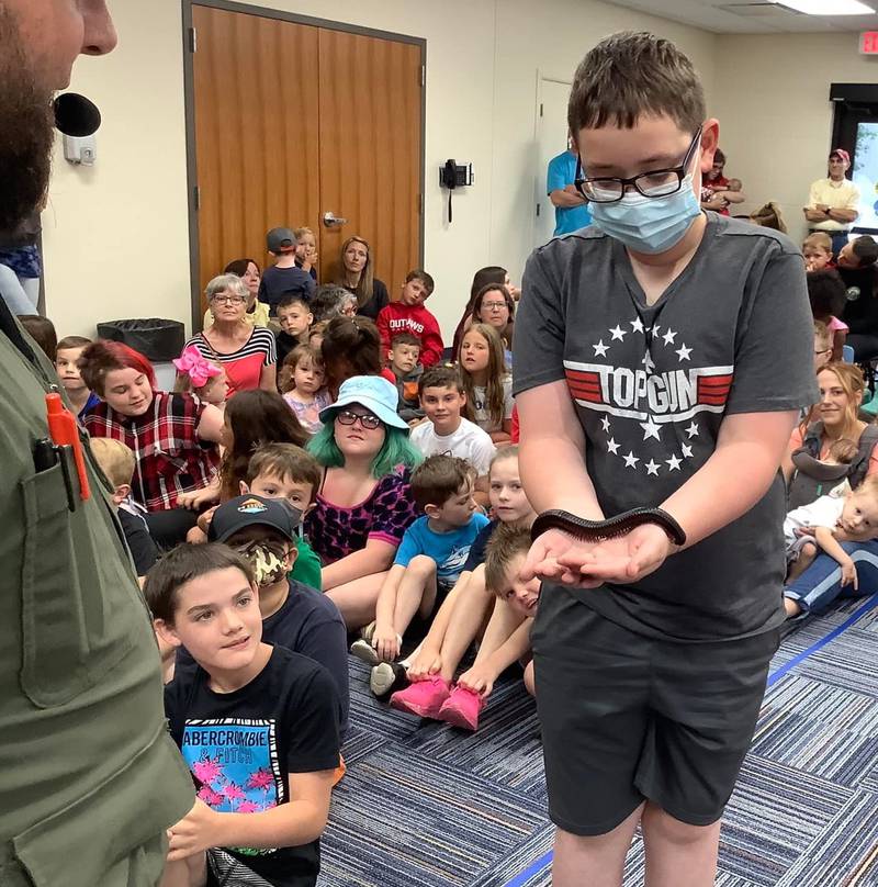 Families visited Ottawa's Reddick Library on Friday, June 10, 2022, for the Crosstown Exotics Traveling Bug and Reptile Show, which included a giant millipede.