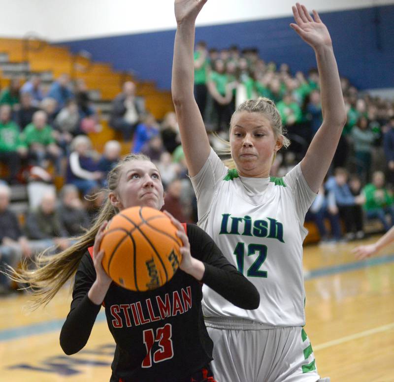 Stillman Valley's Lillian Greene (13) gets ready to shoot as Peoria Notre Dame's Ali Stickelmaier (12) defends at the 2A Super-Sectional on Monday, March 3, 2025 at Bureau Valley High School in Manlius.