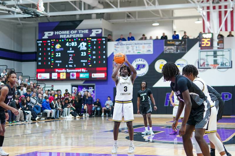 Yorkville Christian's Jayden Riley (3) shoots a free throw during a championship final basketball game in the 61st annual Plano Christmas Classic against Kaneland at Plano High School on Saturday, December 28, 2024.