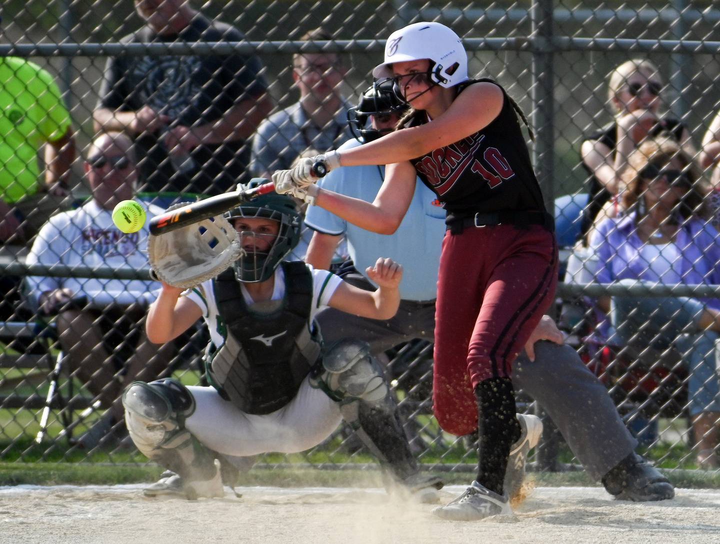 Richmond Burton batter Hailey Holtz makes contact during a game against Rock Falls Tuesday. Catching for Rock Falls is Olivia Osborne.