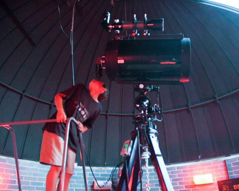 Dean Spect, 10, of DeKalb looks through the telescope at Northern Illinois University's Davis Hall Observatory on Wednesday Aug. 2, 2023 in DeKalb. The observatory reopened after a 3-year hiatus due to the COVID-19 pandemic during a Star Party.