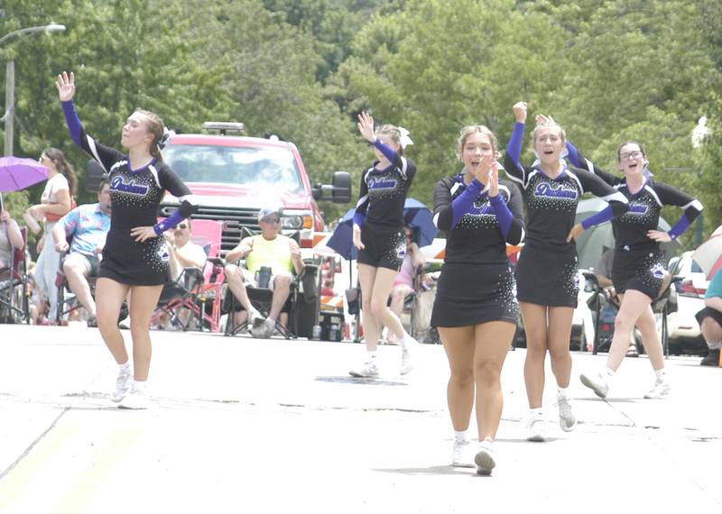 Dixon High School cheerleaders wave to the crowd during the parade on Sunday, July 6, 2025. The 61st Annual Dixon Petunia Fest ran July 3-6, 2025.