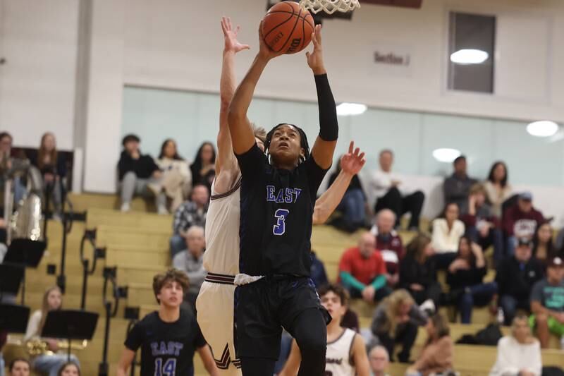 Lincoln-Way East’s Brenden Sanders puts up a shot against Lockport on Friday, Dec. 1, 2023 in Lockport.