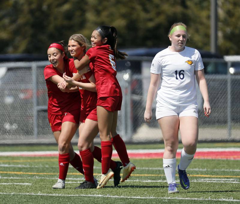 Batavia's Natalie Warner, center is greeted by teammates after scoring Saturday April 8, 2023 in Batavia.