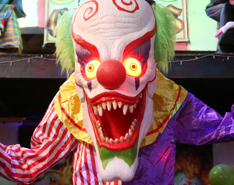 A scary clown's eyes glow during the Nightmare on Fairgrounds Road Haunted Attraction on Wednesday, Sept. 25, 2024 at the Bureau County Fairgrounds in Princeton.