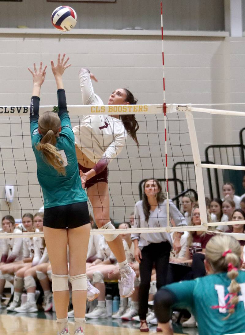 Prairie Ridge’s Head Coach Hilary Agnello watches as her daughter Maizy hits the ball against Woodstock North in IHSA Class 3A Sectional semifinal volleyball action on Tuesday, Nov. 5, 2024, at  Crystal Lake South High School  in Crystal Lake.