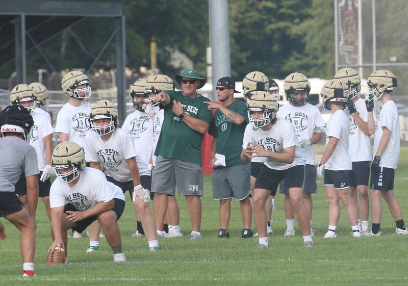 St. Bede head football coach Jim Eustice (center) coaches his team during a 7-on-7 meet against Ottawa on Monday, July 17, 2023 at Ottawa High School.