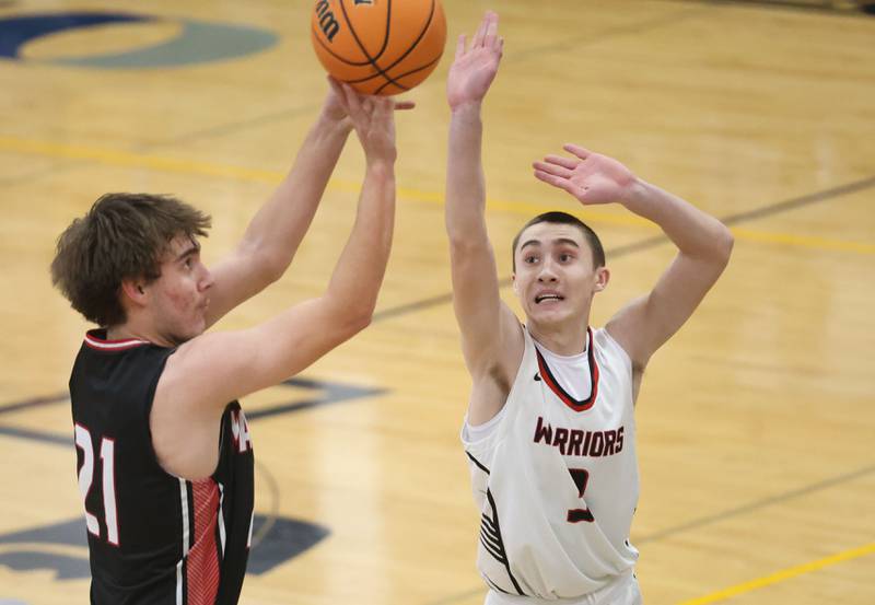 Henry-Senachwine's Carson Rowe shoots a jump shot over Woodland's Grant Wissen during the Tri-County Conference Tournament on Monday, Jan. 26, 2026 at Putnam County High School