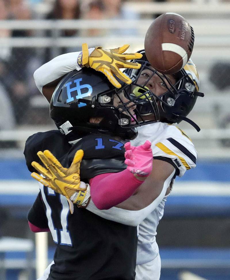 Highland Park's John Walker (17) and Leyden's Damian Salazar (2) collide while trying to collect a pass Friday August 26, 2022 in Highland Park.