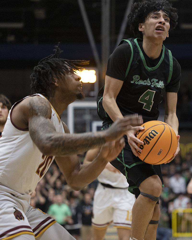 Rock Falls’ Christian Hernandez looks to make a play against Christ the King’s Aaron McClure Monday, March 10, 2025, during the Class 2A boys basketball Supersectional in Sterling.