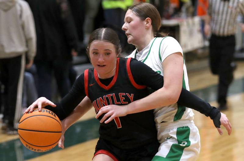 Huntley's Lana Hobday is fouled by Crystal Lake South's Ellie Starnes during a Fox Valley Conference girls basketball game on Friday, Jan. 30, 2026, at Crystal Lake South High School.
