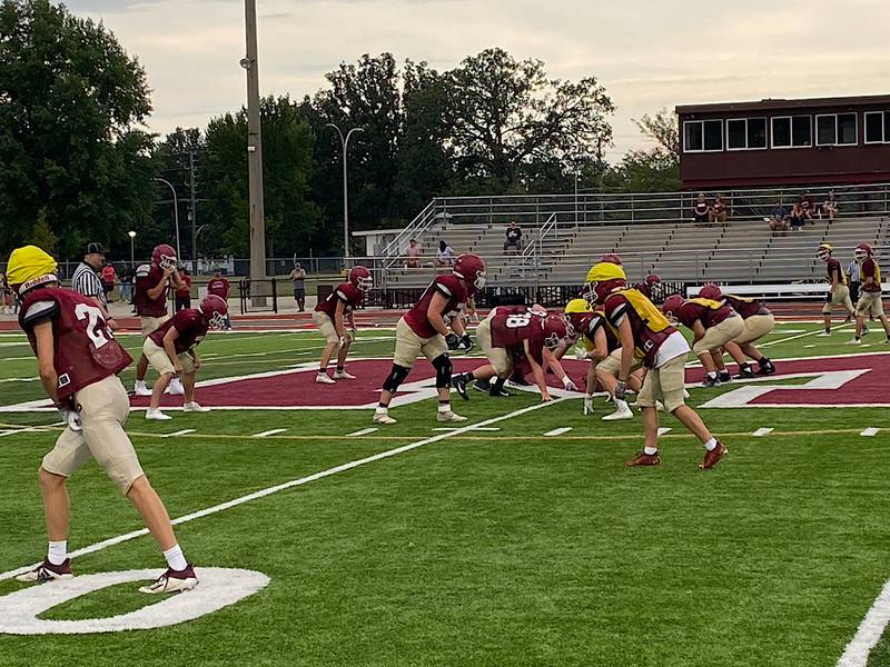 The Morris defense gets ready for a play in its annual Maroon & White scrimmage Friday. Morris returns eight starters from last year's team that finished 10-1.