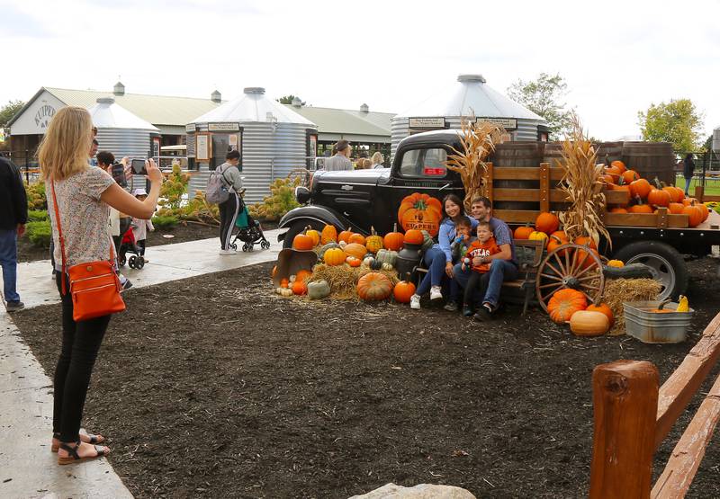A group poses for a photo at Kuiper’s Pumpkin Farm and Apple Orchard in Maple Park on Saturday, Sept. 24, 2022.