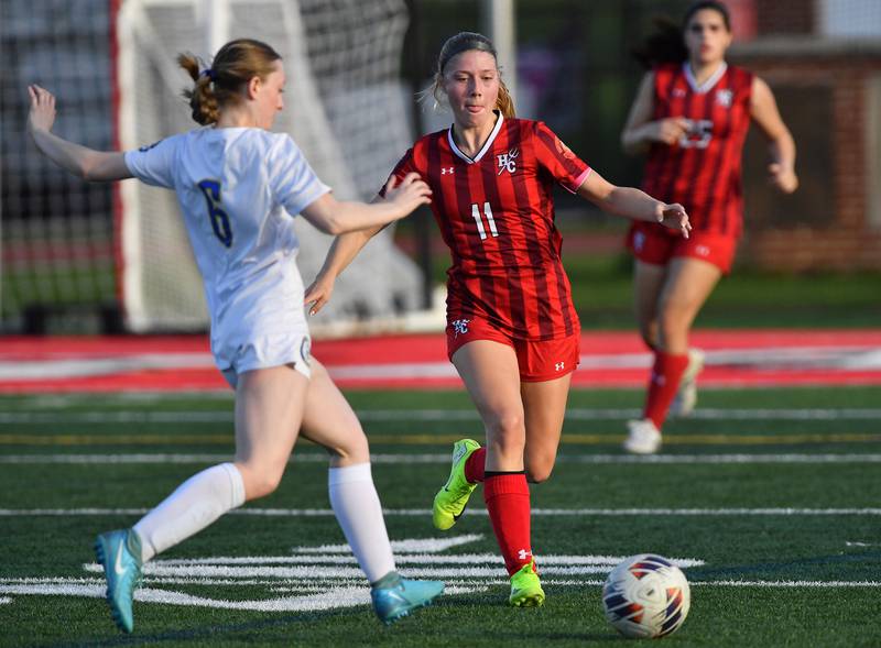 Hinsdale Central’s Peyton Rohn (11) contends for the ball with Lyons Township’s Grace Lanspeary (6) during a game on April 29, 2025 at Hinsdale Central High School in Hinsdale.