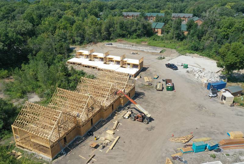 A crew builds new cabin units on Monday, Aug. 28, 2023 at Grand Bear Resort at Starved Rock in Utica. A massive fire destroyed 28 units on Memorial Day Weekend in 2022.