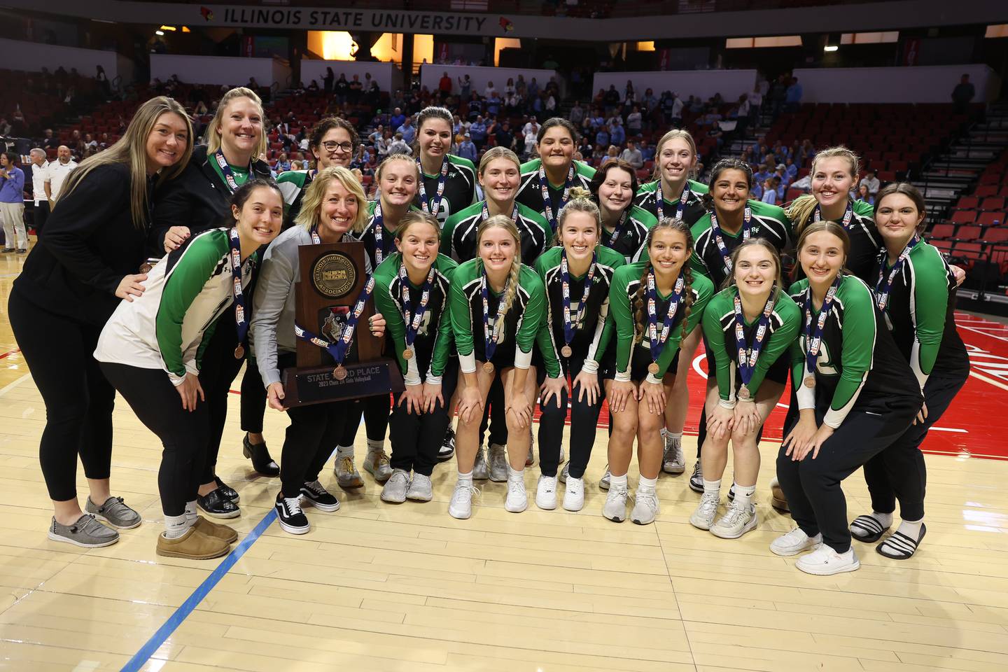 Rock Falls poses with the Class 2A Third Place trophy after the Rockets win against Carmi-White County in the Class 2A Volleyball Third Place match on Saturday, Nov. 11, 2023 in Normal.