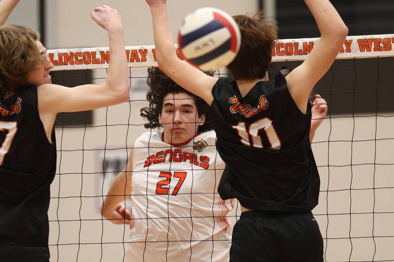 Plainfield East’s Timothy Bannon eyes his shot past the defense for a point against Lincoln-Way West on Wednesday, March 22nd. 2023 in New Lenox.