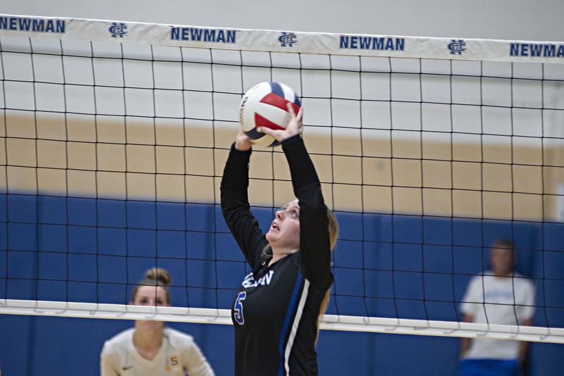 Newman's Molly Olson sets the ball against Sterling Thursday, Aug. 25, 2022.