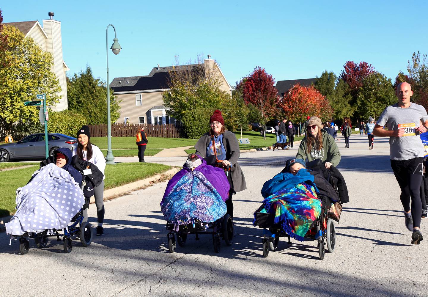 Participants in the Marklund 11th Annual Run, Walk & Roll 5K/1 Mile head towards the finish line on Sunday, Oct. 15, 2023 in Geneva.