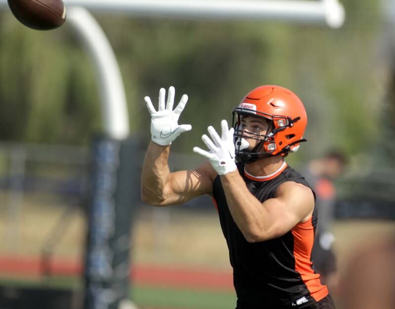Wheaton Warrenville South’s Matt Crider makes a catch during a 7-on-7 football game against Hersey at St. Charles North on Thursday, June 22, 2023.