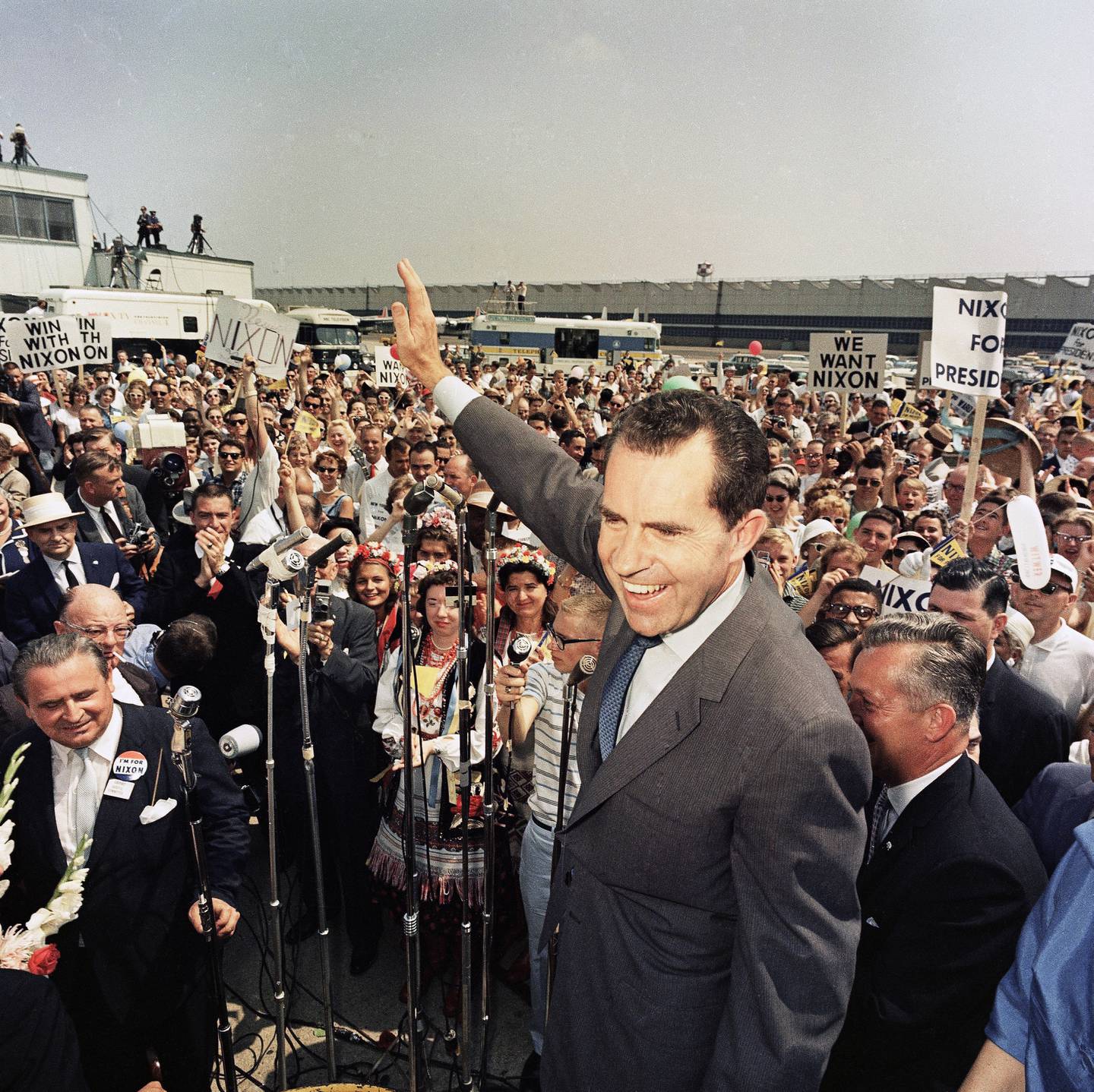 Vice President Richard Nixon arrives at a Chicago Airport and is welcomed by supporters in July 1960.
