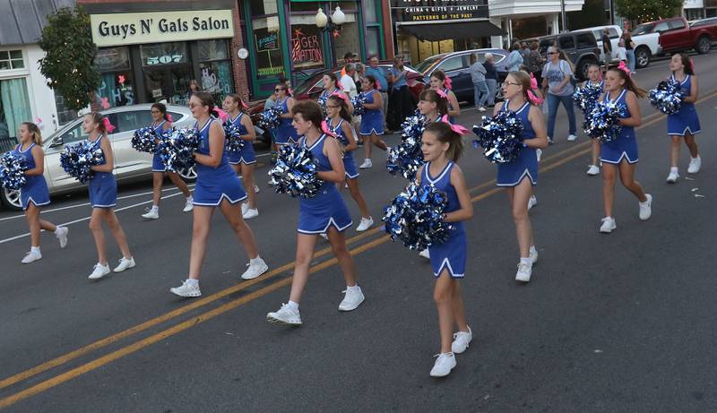 Princeton cheerleaders march during the Princeton High School homecoming parade on Thursday, Sept. 25, 2025 along South Main Street in Princeton .